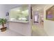 Kitchen features a breakfast bar and access to hallway at 1105 Gondola Park Dr # 1105, Venice, FL 34292