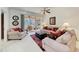 Relaxing living room with beige sofas and red pillows at 1105 Gondola Park Dr # 1105, Venice, FL 34292