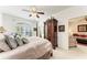 Main bedroom with a king-size bed, built-in armoire and access to sitting area at 1105 Gondola Park Dr # 1105, Venice, FL 34292