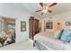 Main bedroom with a king-size bed, and access to a sunroom at 1105 Gondola Park Dr # 1105, Venice, FL 34292