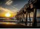 Stunning sunset view over the ocean from a pier at 1105 Gondola Park Dr # 1105, Venice, FL 34292