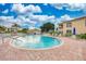 Community pool with surrounding patio furniture at 1105 Gondola Park Dr # 1105, Venice, FL 34292