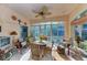 Bright sunroom with wicker furniture and view of the outdoors at 1105 Gondola Park Dr # 1105, Venice, FL 34292