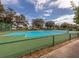 Community tennis courts with chain link fence at 1105 Gondola Park Dr # 1105, Venice, FL 34292