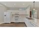 Bright kitchen featuring white cabinets, marble countertops, and recessed lighting at 11508 Water Willow Ave, Lakewood Ranch, FL 34202