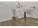 Bright living room with hardwood floors and kitchen view at 11508 Water Willow Ave, Lakewood Ranch, FL 34202