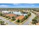 Aerial view of the house and surrounding neighborhood with a lake at 12785 Fontana Loop, Bradenton, FL 34211
