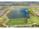 Aerial view of community lake and golf course at 12785 Fontana Loop, Bradenton, FL 34211