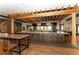 Modern bar with a long counter and high stools at 12785 Fontana Loop, Bradenton, FL 34211