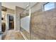 Large bathroom with walk-in shower, granite vanity, and walk-in closet at 12785 Fontana Loop, Bradenton, FL 34211