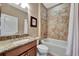 Bathroom with tub, granite countertop, and single vanity at 12785 Fontana Loop, Bradenton, FL 34211