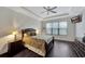 Comfortable bedroom with hardwood floors, ceiling fan, and window coverings at 12785 Fontana Loop, Bradenton, FL 34211
