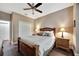 Bedroom with wood floors, ceiling fan, and double door closet at 12785 Fontana Loop, Bradenton, FL 34211