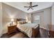 Bedroom with wood floors, ceiling fan, and large window at 12785 Fontana Loop, Bradenton, FL 34211
