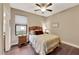 Bright bedroom with wood floors, ceiling fan, and window at 12785 Fontana Loop, Bradenton, FL 34211