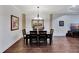 Formal dining room with hardwood floors, chandelier, and large artwork at 12785 Fontana Loop, Bradenton, FL 34211