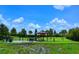 Fenced dog park with shaded seating and grassy areas at 12785 Fontana Loop, Bradenton, FL 34211