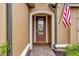 Front entry with arched doorway and brick walkway at 12785 Fontana Loop, Bradenton, FL 34211