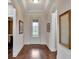 Bright entryway with hardwood floors and large mirror at 12785 Fontana Loop, Bradenton, FL 34211