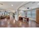 Home office features hardwood floors, built-in shelving, and large window at 12785 Fontana Loop, Bradenton, FL 34211