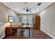 Bright home office with hardwood floors, desk, and built-in storage at 12785 Fontana Loop, Bradenton, FL 34211