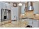 Kitchen with granite countertop, stainless steel appliances, and white cabinets at 12785 Fontana Loop, Bradenton, FL 34211