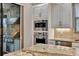 Built-in outdoor kitchen with stainless steel appliances at 12785 Fontana Loop, Bradenton, FL 34211