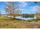 Scenic view of a lake with lush greenery and mature trees at 12785 Fontana Loop, Bradenton, FL 34211