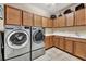 Laundry room with LG washer and dryer, and plenty of cabinet space at 12785 Fontana Loop, Bradenton, FL 34211
