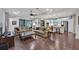 Spacious living room with hardwood floors, comfortable seating and kitchen views at 12785 Fontana Loop, Bradenton, FL 34211