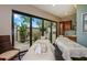 Spa treatment room with two massage tables and access to a patio at 12785 Fontana Loop, Bradenton, FL 34211