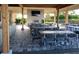 Covered patio with multiple tables and chairs at 12785 Fontana Loop, Bradenton, FL 34211