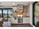 Outdoor kitchen with stainless steel appliances and stonework at 12785 Fontana Loop, Bradenton, FL 34211