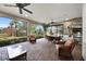 Spacious screened-in patio with outdoor kitchen and seating area at 12785 Fontana Loop, Bradenton, FL 34211