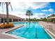 Resort-style pool with spacious deck and palm trees at 12785 Fontana Loop, Bradenton, FL 34211