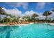 Expansive pool with numerous lounge chairs for relaxation at 12785 Fontana Loop, Bradenton, FL 34211