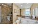 Upscale bathroom with marble shower and vanity at 1300 Benjamin Franklin Dr # 504, Sarasota, FL 34236