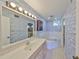 Bathroom with a large vanity, toilet, and jetted tub at 131 Pinehurst Dr # 131, Bradenton, FL 34210