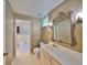 Bathroom with a large vanity, toilet, and jetted tub at 131 Pinehurst Dr # 131, Bradenton, FL 34210