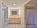 Bright bathroom with vanity, large mirror, and shower at 131 Pinehurst Dr # 131, Bradenton, FL 34210