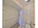 Clean bathroom featuring a shower and grab bars at 131 Pinehurst Dr # 131, Bradenton, FL 34210