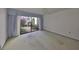 Bedroom with sliding glass doors to a patio at 131 Pinehurst Dr # 131, Bradenton, FL 34210
