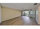 Bedroom with sliding glass doors and wood floors at 131 Pinehurst Dr # 131, Bradenton, FL 34210