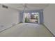 Bedroom with sliding glass doors to a patio at 131 Pinehurst Dr # 131, Bradenton, FL 34210