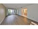 Bedroom with sliding glass doors and wood floors at 131 Pinehurst Dr # 131, Bradenton, FL 34210