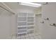Large walk-in closet with shelving and hanging rods at 131 Pinehurst Dr # 131, Bradenton, FL 34210