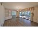 Bright dining room with hardwood floors and patio access at 131 Pinehurst Dr # 131, Bradenton, FL 34210