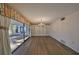 Spacious dining room with hardwood floors and access to patio at 131 Pinehurst Dr # 131, Bradenton, FL 34210