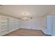 Bright dining room with hardwood floors and built-in shelving at 131 Pinehurst Dr # 131, Bradenton, FL 34210