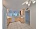 Bright kitchen with light wood cabinets and white appliances at 131 Pinehurst Dr # 131, Bradenton, FL 34210